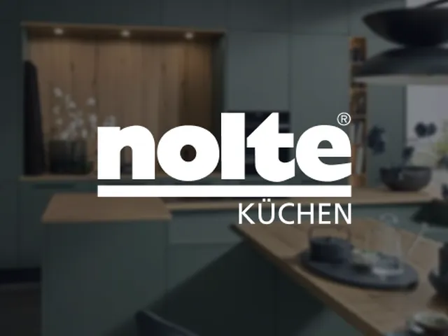 "Nolte Küchen logo over a modern kitchen interior with sleek cabinetry, wooden countertops, and soft lighting."