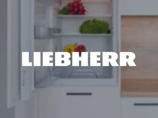 An open refrigerator with vegetables inside, including peppers and lettuce. The brand "Liebherr" is prominently displayed over the image.