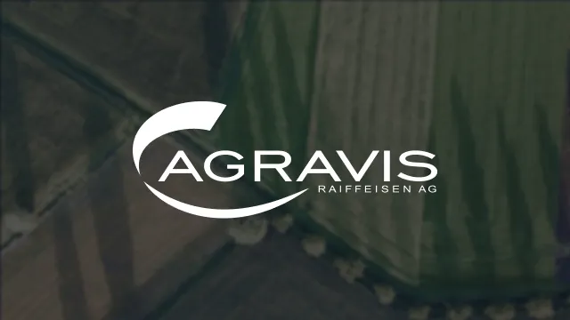 Logo of AGRAVIS Raiffeisen AG over a blurred aerial view of agricultural fields.